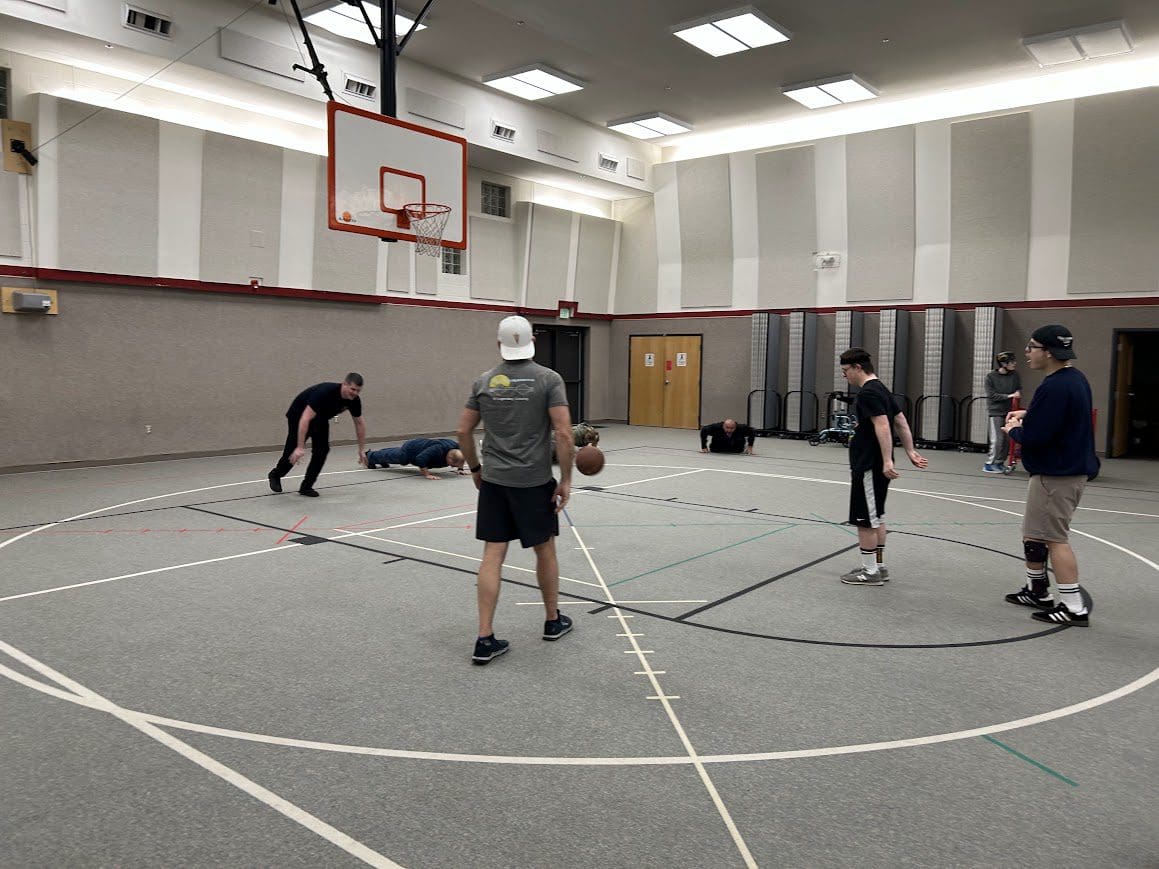 Pickup basketball game on indoor court